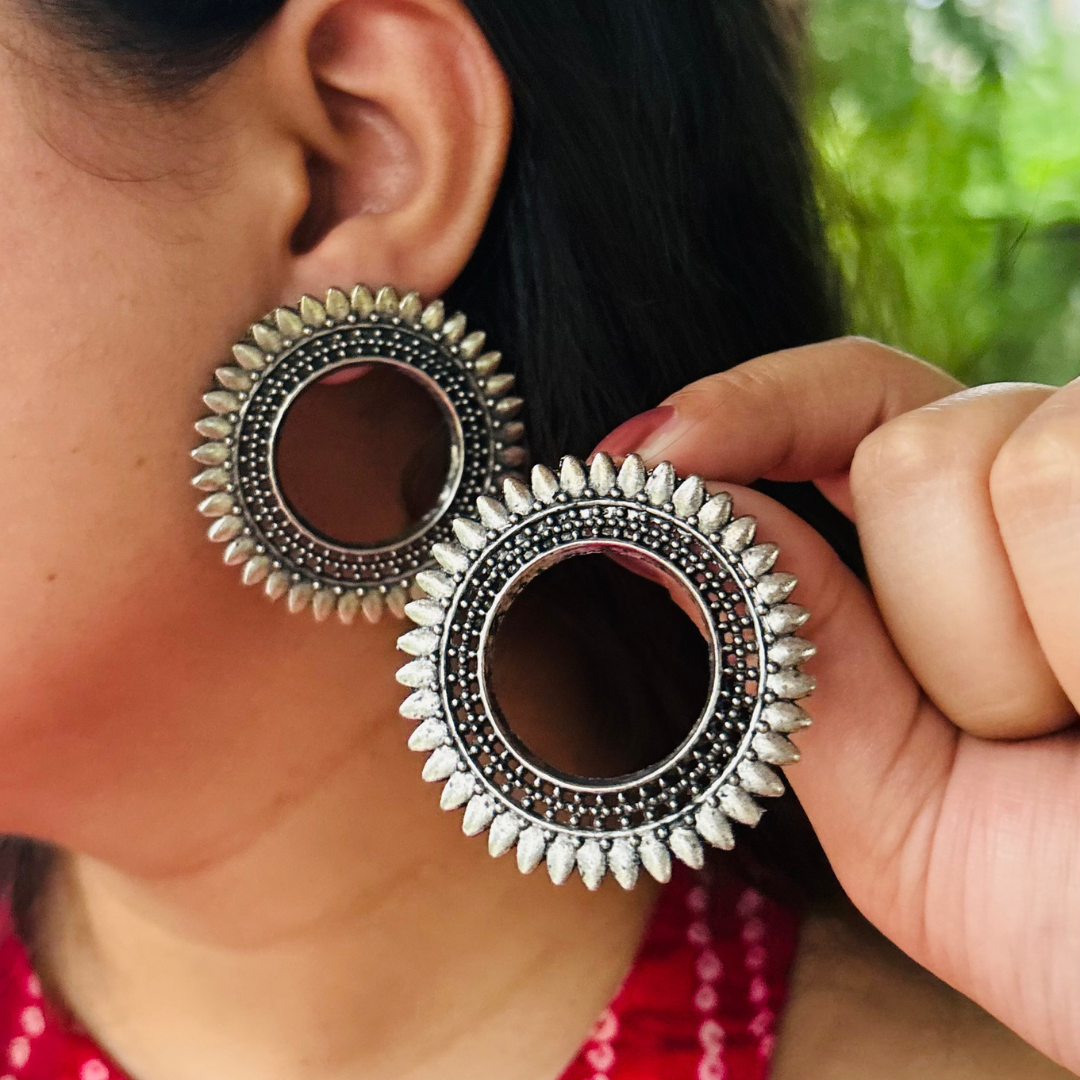 Pushpa Chakra Studs – Premium German Silver Earrings by DAYERA